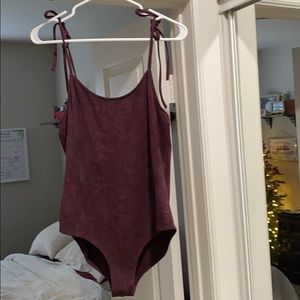 Purple velour Onesie, with drawstring straps.